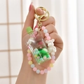 Dettaglio del portachiavi in acrilico con sabbie mobili e ciondolo a forma di orso - Corda Sfumata + Tazza di Bubble Tea con Perle Colorate / Tazza con Ventosa [Verde]