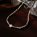 Close-up of colorful beads and silver-toned cubes choker with a white daisy charm - Multi-color Flower Silver-tone Beads Necklace