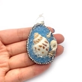 Blue resin teardrop pendant with natural shells and sparkling crystal rhinestones - Light Blue