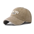 Detailed macro view of white 3D NEW YORK embroidery on a khaki washed cotton baseball cap - Adjustable / NEW YORK Khaki