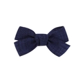 Detail view of a handcrafted dark blue fabric bow hair clip with textured fabric material - Navy Blue (1)