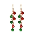 Detail view of festive Christmas bell drop earrings with red and green bells on gold chains - Vertical Red Green Bell Chain