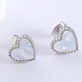 Elegant stainless steel heart stud earrings featuring white mother-of-pearl insets - Steel