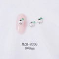 Macro detail of 8x8mm peach-shaped alloy nail charms with green enamel leaf accents - Bright Silver Peach (Silver Base) (8336)