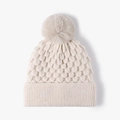 Winter knit beanie for women in beige with a matching large faux fur pom-pom topper - Beige