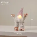 Pink LED Christmas gnome doll with glowing nose and rose gold boots for table decor - Happy Gnome Standing with LED