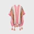 Knitted boho poncho shawl in pink and beige with wave patterns and fringe trim - Deep Pink