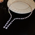 Detailed view of silver necklace with water-drop zircons on cream ceramic plate - Silver Zirconia Water Drop Choker Style
