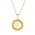 Macro shot of gold stainless steel necklace with crystal-encrusted letter F pendant - Letter F