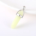 Pale yellow-green hexagonal stone bullet pendant with a polished silver metal clasp - Luminous Stone