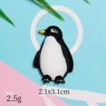 Detail view of a 2.1x3.1cm resin penguin charm with size and weight specifications - Penguin