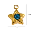 Macro detail of a 11mm star pendant in 14K gold stainless steel with a blue center gem - Lake Blue Rhinestone