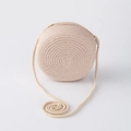 Detail of round straw woven shoulder bag for girls in beige with spiral strap detail - Pink Large Round Bag (15*7cm)