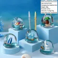 Blue ocean-themed hourglass pen holder with floating beach elements and liquid sand - Ocean Beach Semi-Circle (Luminous)