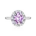 Oval pink gemstone ring with white halo crystals on a silver adjustable band - Adjustable Open / Purple Zirconia