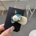 Acetate hair clip with pearls and crystal in green and beige, held by a model - Large Pearl Square Rhinestone Irregular Alligator Clip / Lake Blue