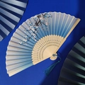 Chinese bamboo folding fan with blue gradient silk, white flower patterns and blue tassel - Blue Gradient White Flower