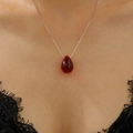 Close-up of minimalist silver chain necklace featuring a vibrant red resin teardrop pendant - Silver Chain Red Gemstone Teardrop Necklace Style (WG-0849)