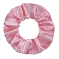 Detailed view of glossy bright pink satin scrunchie showing fabric folds and texture - Pink