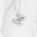 Macro shot of silver balloon style letter Z pendant with glossy mirror finish necklace - Letter Z Pendant