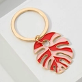 Gold-plated Monstera leaf keychain with vibrant red and pink enamel drip oil design - Red and Pink Monstera Leaf / Red