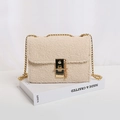 Chic cream fleece crossbody bag featuring a gold chain strap and elegant metal lock closure - White
