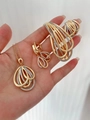 Golden and silver jewelry set with necklace earrings and bracelet on hand - Four-Piece Set
