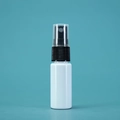 White plastic spray bottle with a black nozzle and clear cap on a cyan background - 20ml / Porcelain White Bottle Black Spray