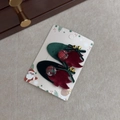 Christmas hair clips with velvet reindeer leaves, plaid berries and golden bells on a card - Green Leaf Hairpin Pair
