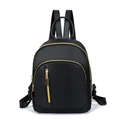 Detail of black nylon backpack featuring premium leather handles and gold metal zippers - Black