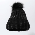 Detail of black ribbed knit beanie featuring sparkling rhinestones and a fluffy faux fur pom - Black (Black Rhinestones)