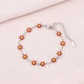 Detail showing red daisy flower petal charms on a silver stainless steel bracelet - Red (Silver)