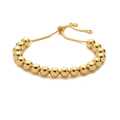 Detail eines verstellbaren Goldperlenarmbands mit hochglanzpolierter Oberfläche - 8mm Perle / Gold