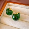 Macro detail of dark green resin drop earrings with gold trim on jewelry display tray - Green Amber Waterdrop Stud Earrings (HE17677)