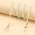 Detailed shot of colorful crystal beads on glasses chain with silver lobster clasps - Blue