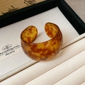 Wide C-shape open cuff bracelet in vintage tortoiseshell amber resin pattern - Brown