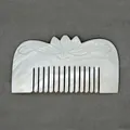 Handcrafted mother of pearl shell comb featuring elegant lotus flower relief carving - Lotus Flower Comb