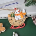 Festive snowman on sled hanging ornament with gift box details and rustic jute rope - Yellow Sleigh Snowman