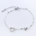 Elegante pulsera de acero inoxidable con corazón hueco y pequeño dije de diamante fino - Color Acero