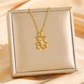 Titanium steel necklace with hollow gold bear pendant and sparkling crystals on a gift box - Gold Bear (8095)