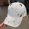 White baseball cap with colorful butterfly embroidery and sparkling silver rhinestones - Adult One Size (Adjustable) / White