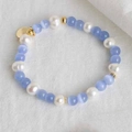 Close-up of glacier blue cat-eye beads and pearls with heart pendant necklace - Blue Cat's Eye Elastic Bracelet 16cm