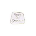 Macro shot of white enamel brooch with golden You Are Enough lettering detail - You Are Enough White Gold Edge