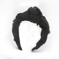 Elegant black pleated fabric headband with faux pearl beads and a top knot design - Black