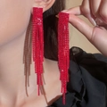 Elegant long fringe earrings with vibrant red rhinestones on a female model - High Saturation Red Full Rhinestone Tassel