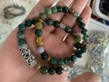 Detail of beaded bracelet featuring green stones with gold Buddha head and silver hollow bead - Gold Buddha Green Jade Stone