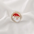Christmas Santa Claus brooch with rhinestones and gold frame on white silk background - Santa Claus