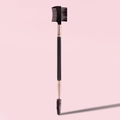 Close-up of dual-ended eyebrow and eyelash brush with pink handle and rose gold ferrule - Dual Eyebrow Brush with Comb Black Gold