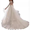 Elegant white long sleeve lace wedding dress with open back button detail and long tulle train - US 2 / Trailing