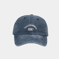 Detailed view of California 1987 embroidery on washed denim blue baseball cap - Adjustable / Navy Blue